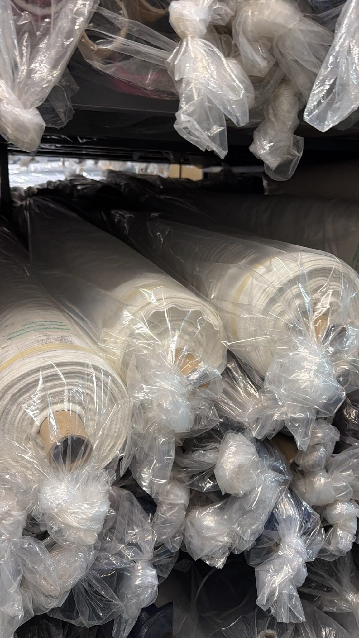 Stacked fabric roll storage